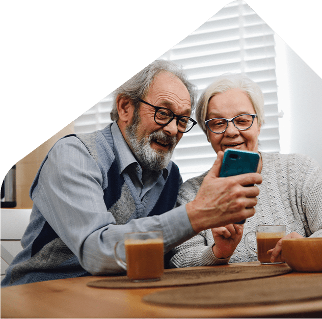 older couple checking rent payments using mobile